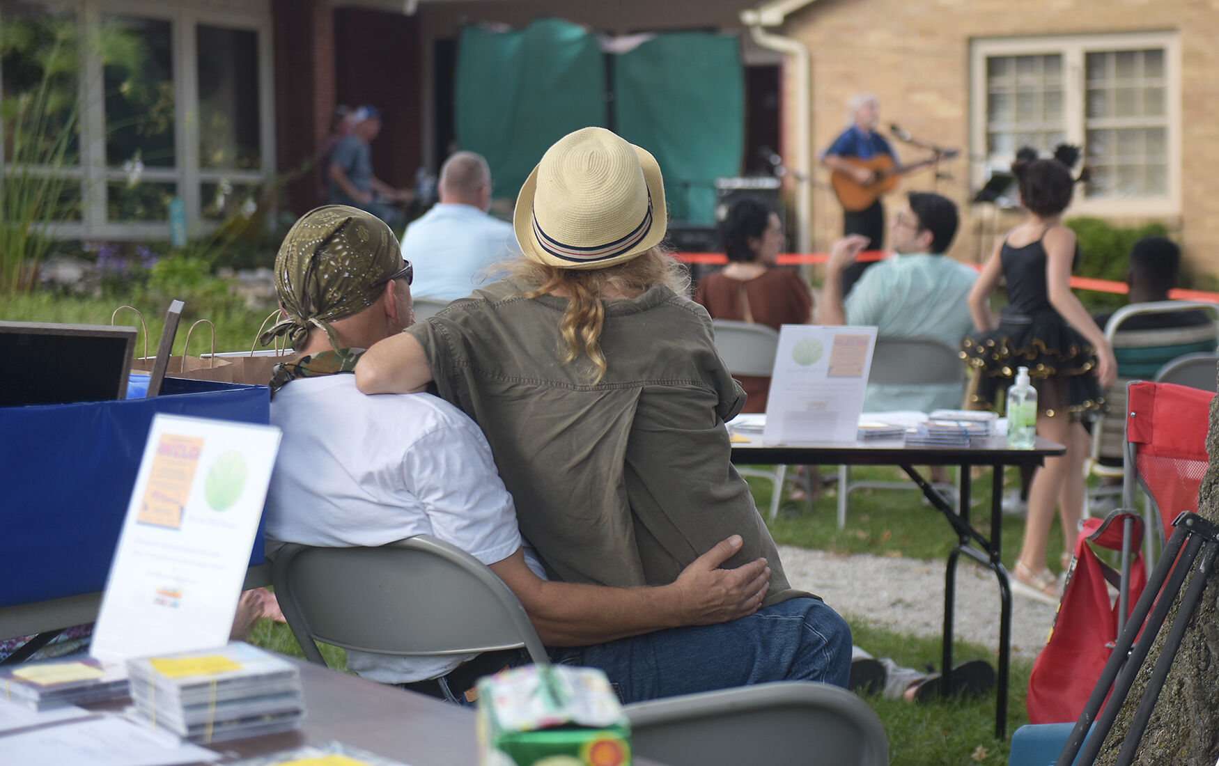 L.R. Hults and Cheryl Black watch a musical performace
